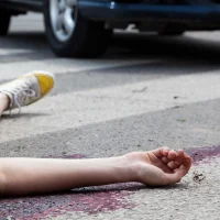 unconscious-woman-at-accident-scene unconscious-woman-at-accident-scene