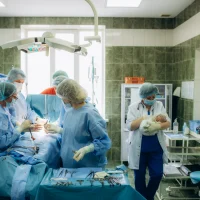surgeons-perfoming-surgery-operation-of-abdominal-cesarean-section-during-child-delivery-birth-at-clinic-operating-room